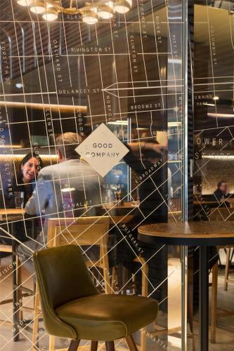 a room with a table and a sign that reads good curry at Hyatt Centric Times Square New York in New York