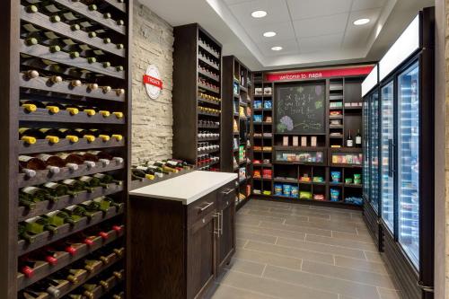 a wine store with a wine cellar with wine bottles at Hampton Inn & Suites - Napa, CA in Napa
