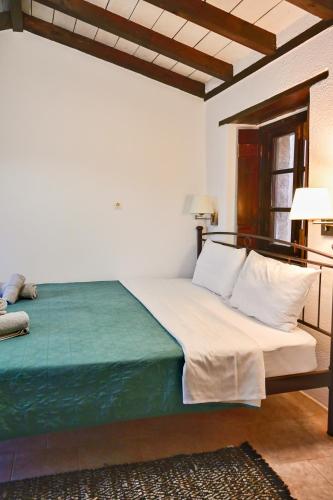 a bedroom with a large bed in a room at Pablito House-Seaview Monemvasia Nests in Monemvasia