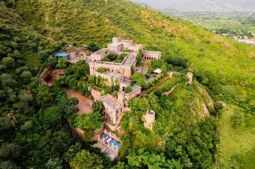 an aerial view of a mansion on a hill at Fort Dadhikar, Alwar in Alwar