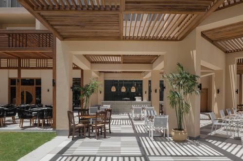 Restaurant ou autre lieu de restauration dans l'établissement JAZ Elite Asteria