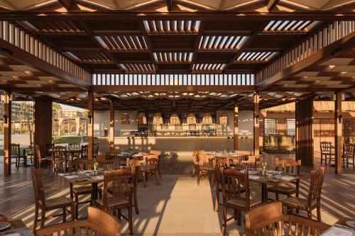 Restaurant ou autre lieu de restauration dans l'établissement JAZ Elite Asteria