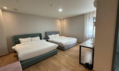 Katil atau katil-katil dalam bilik di Miryang Ever Miracle Hotel