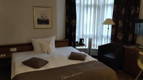 Postel nebo postele na pokoji v ubytování Tandreas Hotel & Restaurant
