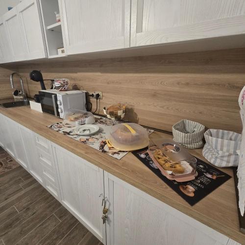 a kitchen counter with some food on it at Miluna Affittacamere in Siniscola