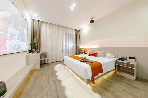 Katil atau katil-katil dalam bilik di Huanyi Hotel
