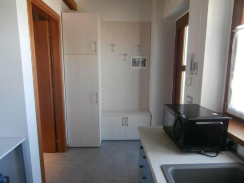 Η κουζίνα ή μικρή κουζίνα στο Albergo Diffuso Magredi