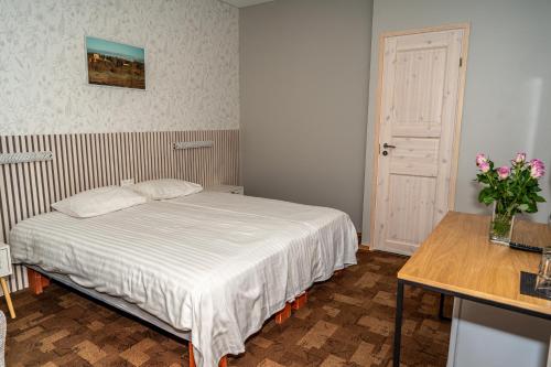 Cama o camas de una habitación en Männimäe Guesthouse