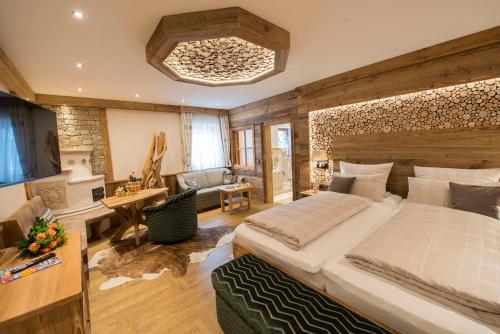 a bedroom with a large bed in a room at Wellness-Hotel ADLER in Bad Wörishofen