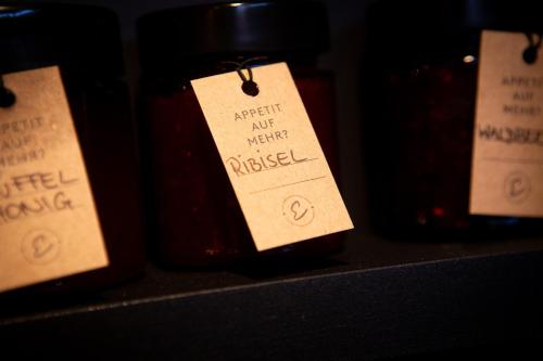 a bottle of wine with a tag on it at Hotel Elisabeth, 4 Sterne Superior in Kirchberg in Tirol