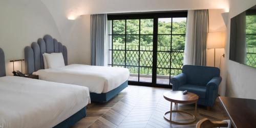 Ein Bett oder Betten in einem Zimmer der Unterkunft Ecoland Hotel