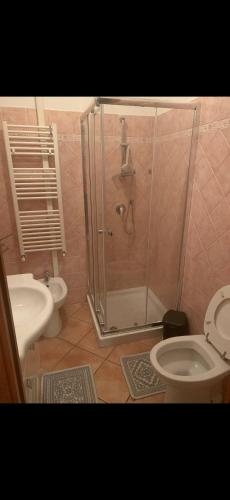a bathroom with a shower and a toilet and a sink at 80vogliadirelax in Rome