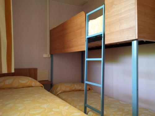 Säng eller sängar i ett rum på Camping l'Alqueria