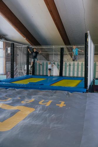 a group of kids playing on a trampoline at Hotel Lärchenhof in Katschberghöhe