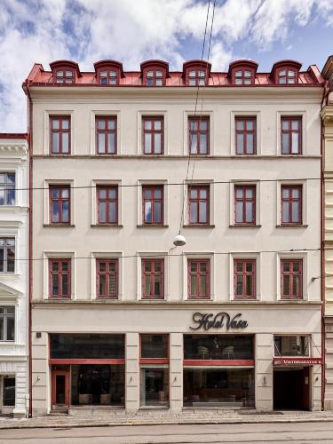 a large white building with red windows at Hotel Vasa, BW Signature Collection in Gothenburg