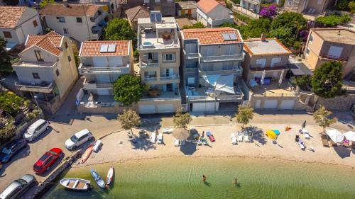 an aerial view of a beach with a building at Apartmani Spajić Duboka by aneo travel in Klek