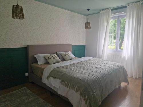 Postel nebo postele na pokoji v ubytování maison à la campagne