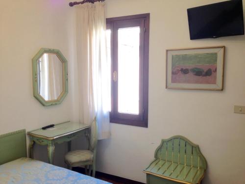 TV a/nebo společenská místnost v ubytování Hotel Serenissima