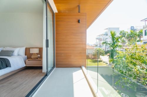 Postel nebo postele na pokoji v ubytování Modern Tropical Pool Villa - Saiyuan