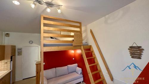 En eller flere senge i et værelse på Les Ambassadeurs 106 La Bourboule