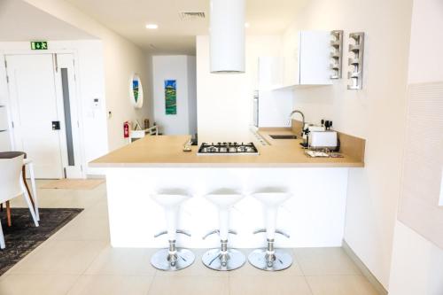 A kitchen or kitchenette at Gorgeous 2BR Gozo Apt with private balcony & Pool by 360 Estates