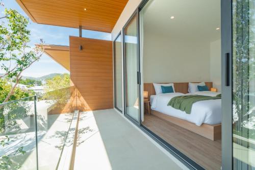 Postel nebo postele na pokoji v ubytování Modern Tropical Pool Villa - Saiyuan
