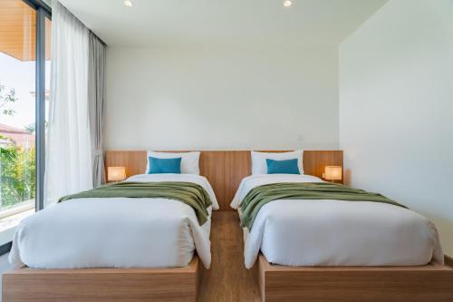 Postel nebo postele na pokoji v ubytování Modern Tropical Pool Villa - Saiyuan