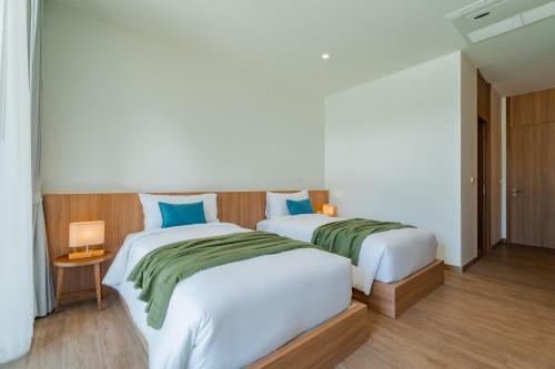 Postel nebo postele na pokoji v ubytování Modern Tropical Pool Villa - Saiyuan