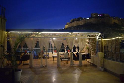 a tent on top of a building at night at Hotel The Surya Jaisalmer in Jaisalmer