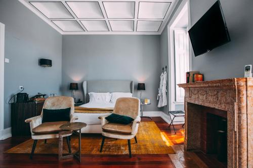TV a/nebo společenská místnost v ubytování Torel Palace Lisbon
