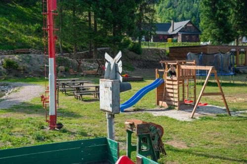 a park with a playground with a slide at Hotel Telgárt - Turistické ubytovanie in Telgárt