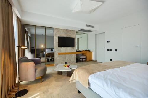 Ένα ή περισσότερα κρεβάτια σε δωμάτιο στο ONE Hotel