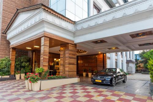 a car parked in front of a building at Radisson Srinagar in Srinagar