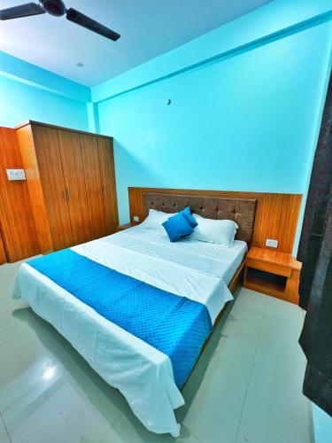 Ένα ή περισσότερα κρεβάτια σε δωμάτιο στο Hotel Stayour Inn