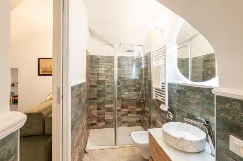 a bathroom with a shower and a sink at GuestHost - La Dimora dei Capitani in Cervo