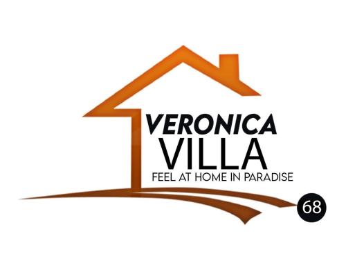 a house with the text verona villa felt at home in paradise at Veronica Villa 68 in Lucea