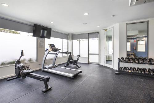 a gym with two treadmills and a treadmill at Nightelier Doncaster in Doncaster