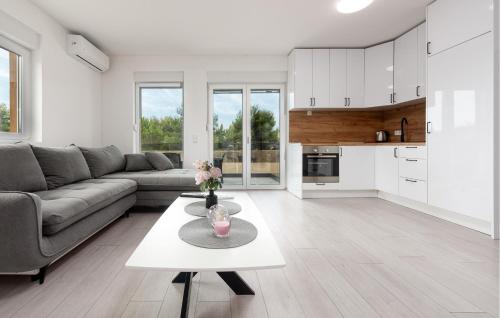 a living room with a couch and a table at 2 Bedroom Gorgeous Apartment In Vir in Vir