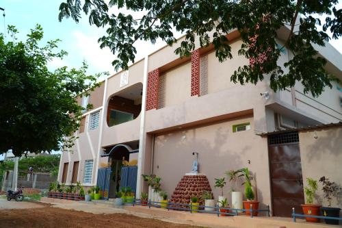 a view of the front of a building at Shanthi Guest House in Hampi