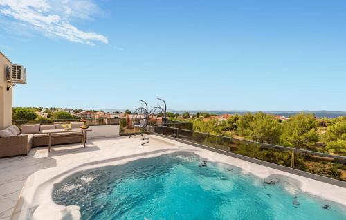 a hot tub on the balcony of a house at 2 Bedroom Gorgeous Apartment In Vir in Vir