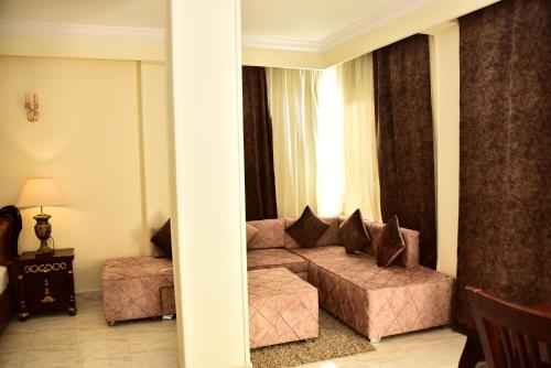 a living room with a couch and a window at Hollywood Aqua Park Sharm El-Sheikh in Sharm El Sheikh