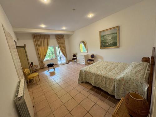 a bedroom with a bed and a tiled floor at Baccano Escape in Rome