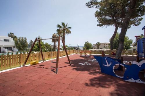 a playground with a swing set in a park at Aiora Resort in Pefki Rhodes