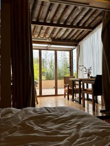 Katil atau katil-katil dalam bilik di Dali Fenghe Sansheng Homestay
