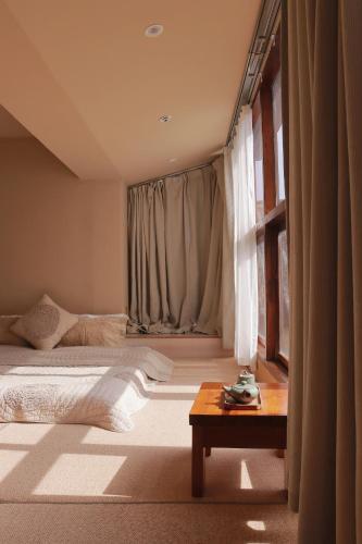 Katil atau katil-katil dalam bilik di Dali Fenghe Sansheng Homestay