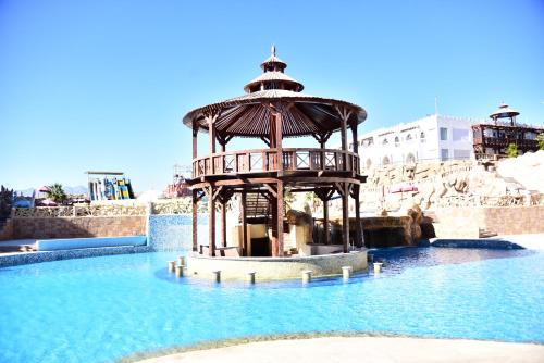 a water park with a tower in the middle of the water at Hollywood Aqua Park Sharm El-Sheikh in Sharm El Sheikh