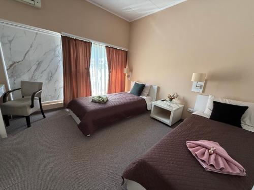Postel nebo postele na pokoji v ubytování Aparthotel Waldinger Skopje