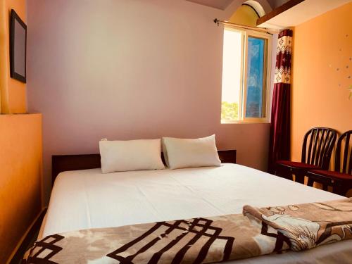 Postel nebo postele na pokoji v ubytování Shiv Sadan Homestay