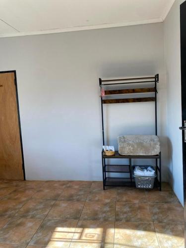a room with a bunk bed in a room at Inn on Lichfield Lane in Harare