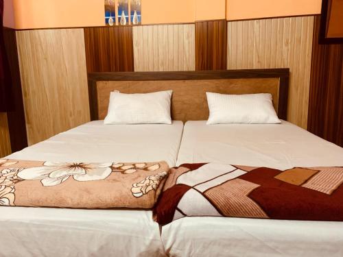 Postel nebo postele na pokoji v ubytování Shiv Sadan Homestay